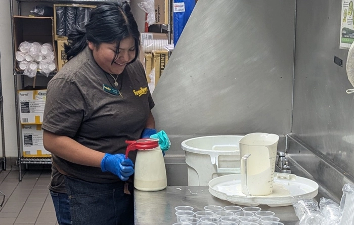  Senior Naomi working in a local restaurant. 