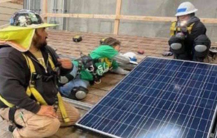 Students learning how t install solar panel.